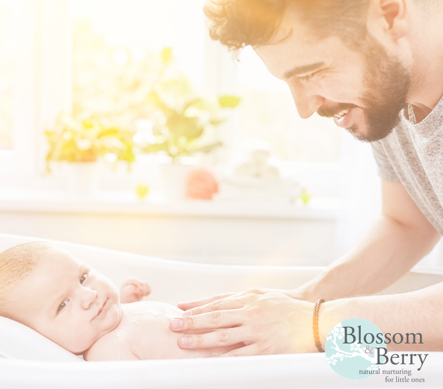 Picture of father massaging a baby