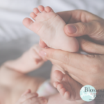 Picture of a babies foot being held in a hand