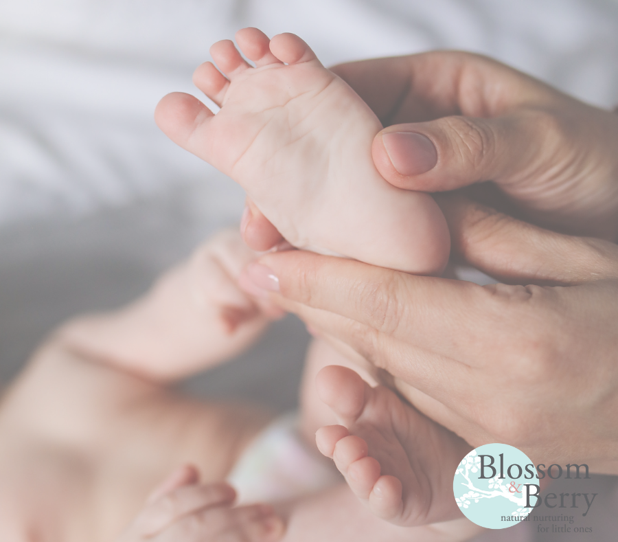 Picture of a babies foot being held in a hand