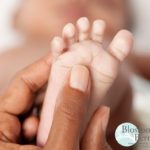 Close up of a babies foot being massaged