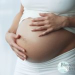 Picture of a pregnancy tummy with hands on it