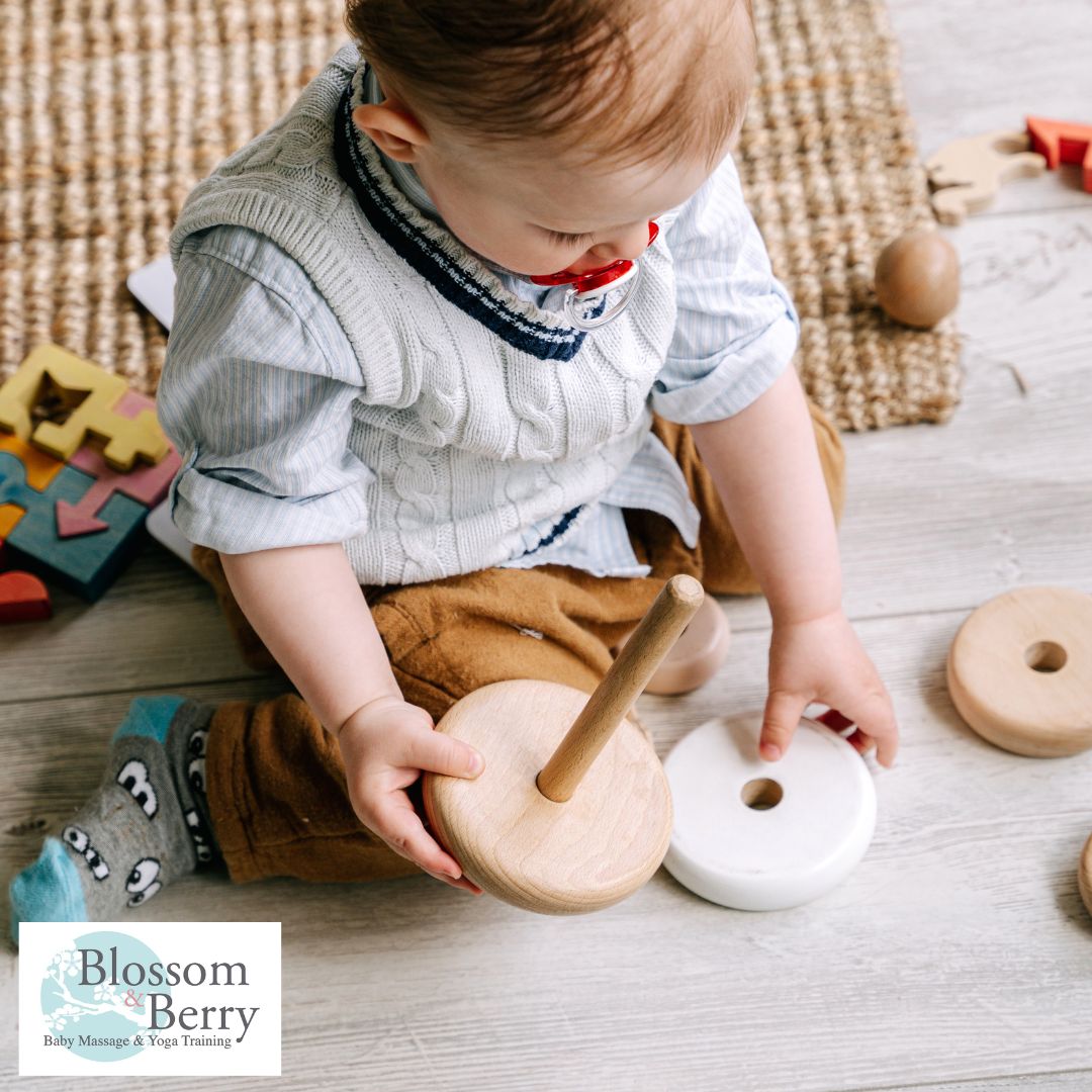 Right Brain Development in Babies: Tips to Nurture Creativity and Emotional Growth - picture of a baby playing with a toy on the floor