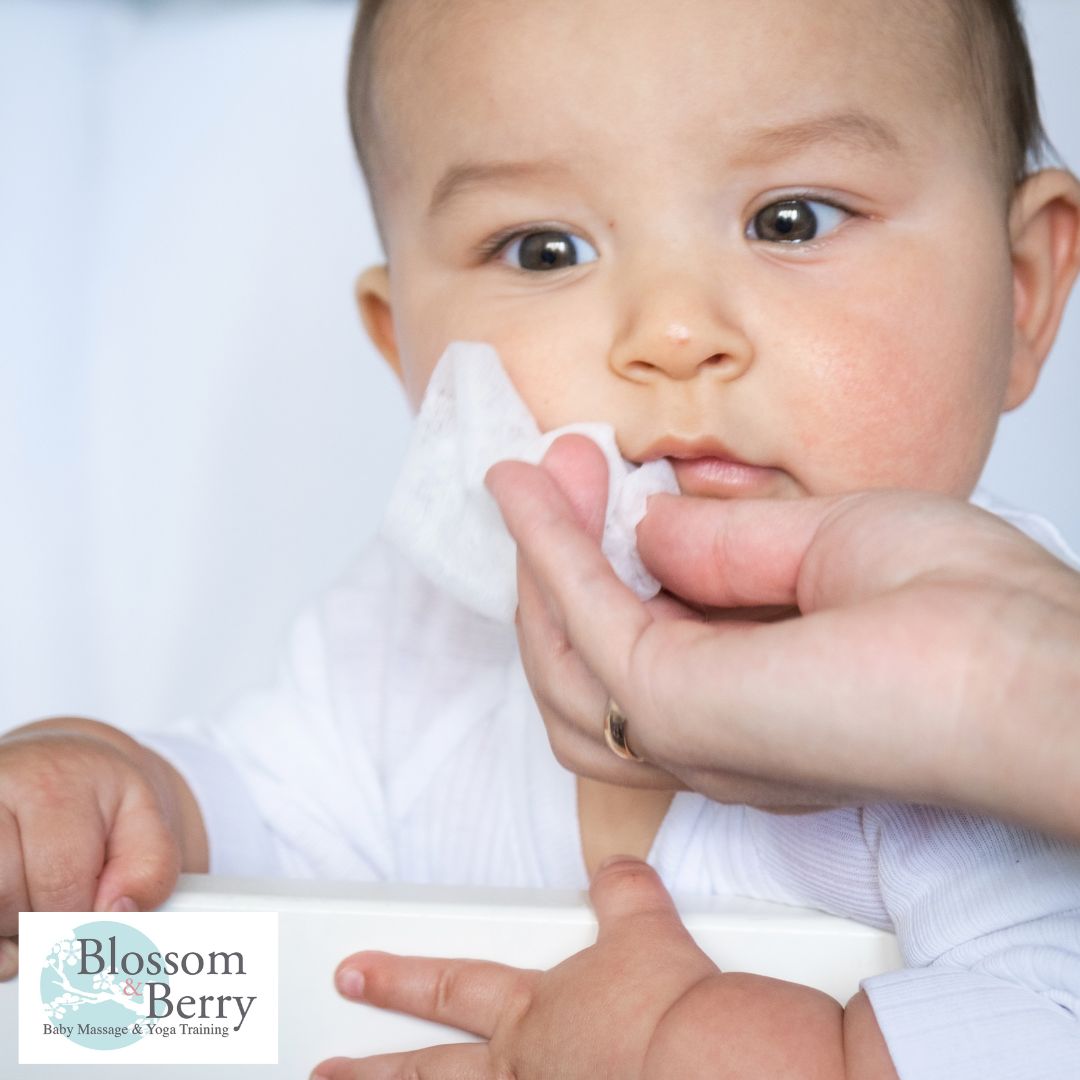 Does Baby Massage Help with Coughs and Colds? The Soothing Power of Touch - picture of a baby having it's nose wiped with a tissue